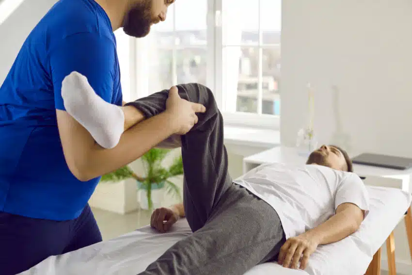 Chiropractor having a Sports Injury Treatment in West Omaha with a patient