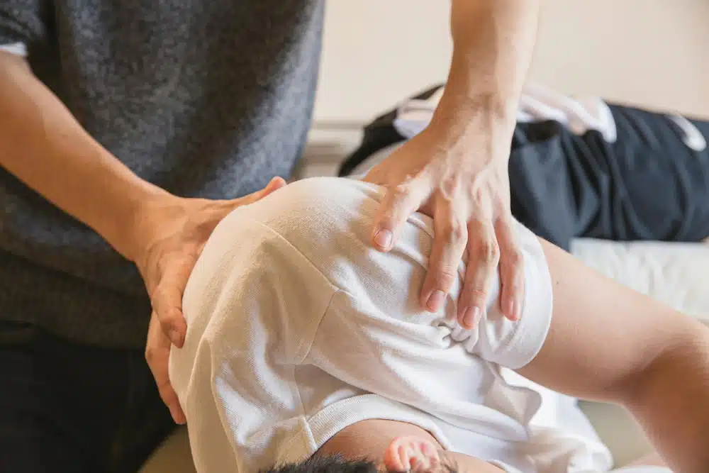 Chiropractor doing some chiropractic care treatment to the patient