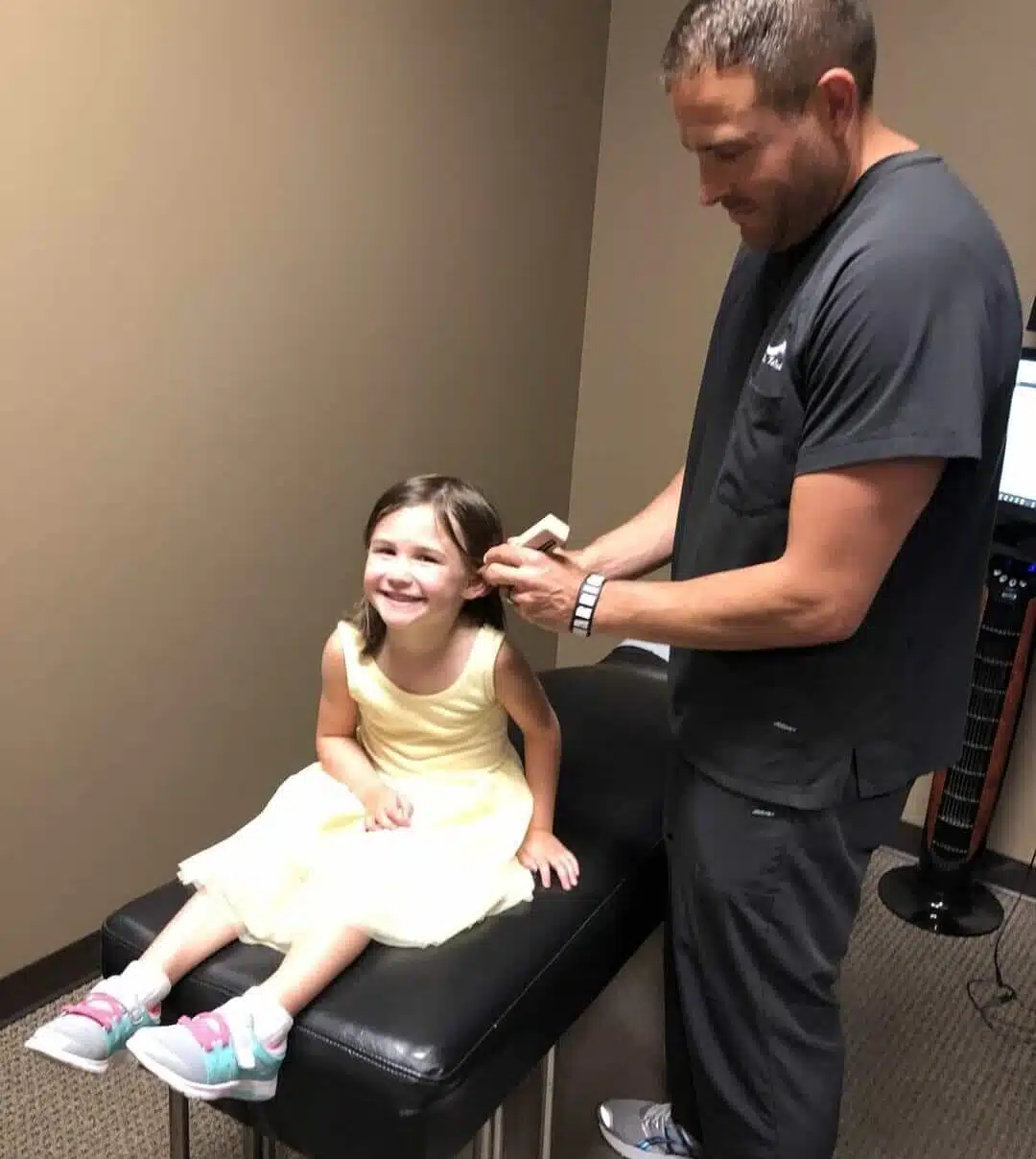 Pediatric Chiropractor Checking the Temperature a child patient